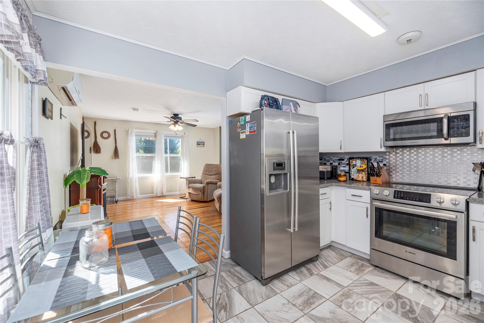 29 Arrowhead Street Clyde, NC 28721 - Photo 7 of 18 a kitchen with stainless steel appliances granite countertop a refrigerator stove and sink