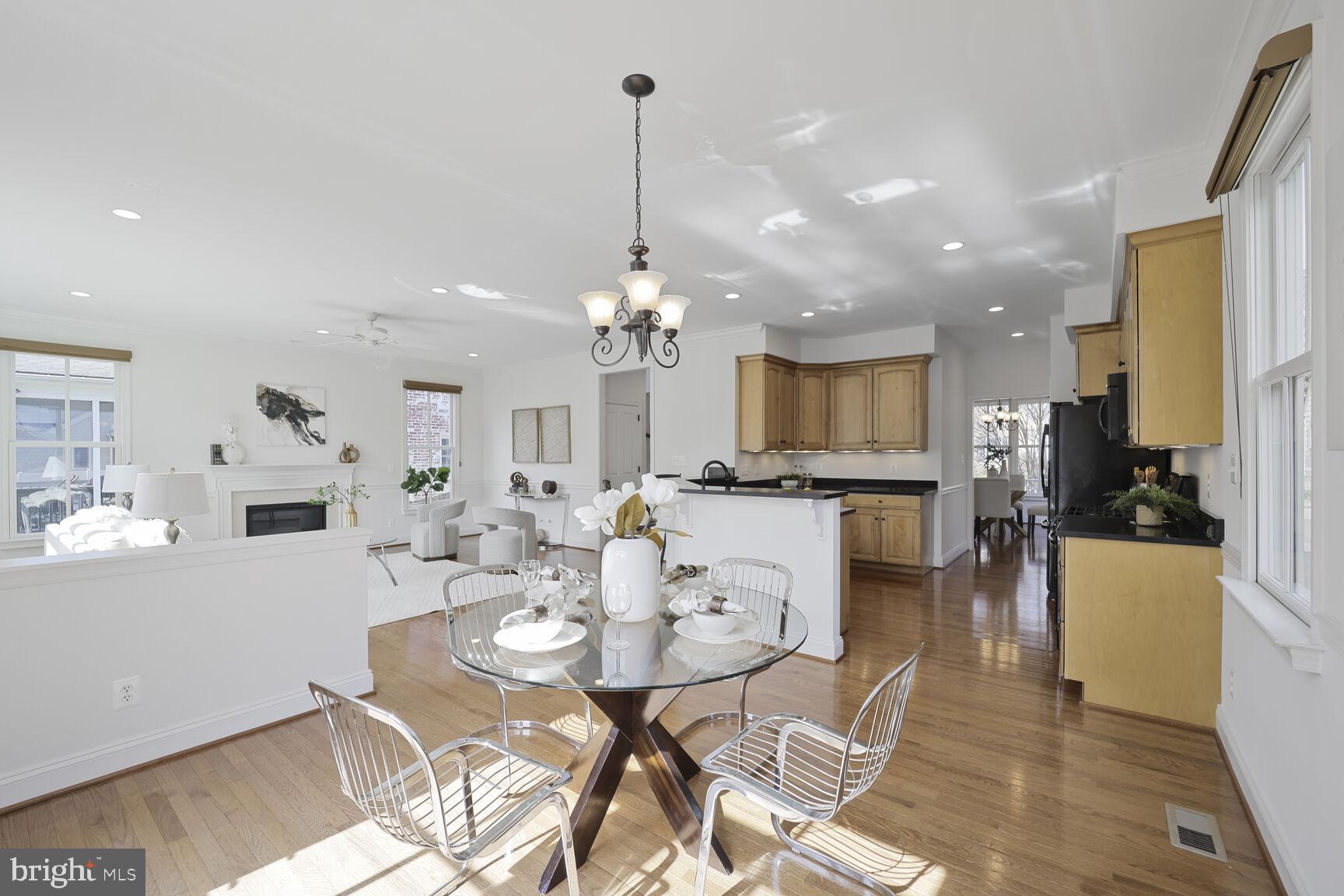 4814 25th Road North Arlington, VA 22207 - Photo 17 of 45 a view of a dining room and livingroom with furniture wooden floor a chandelier