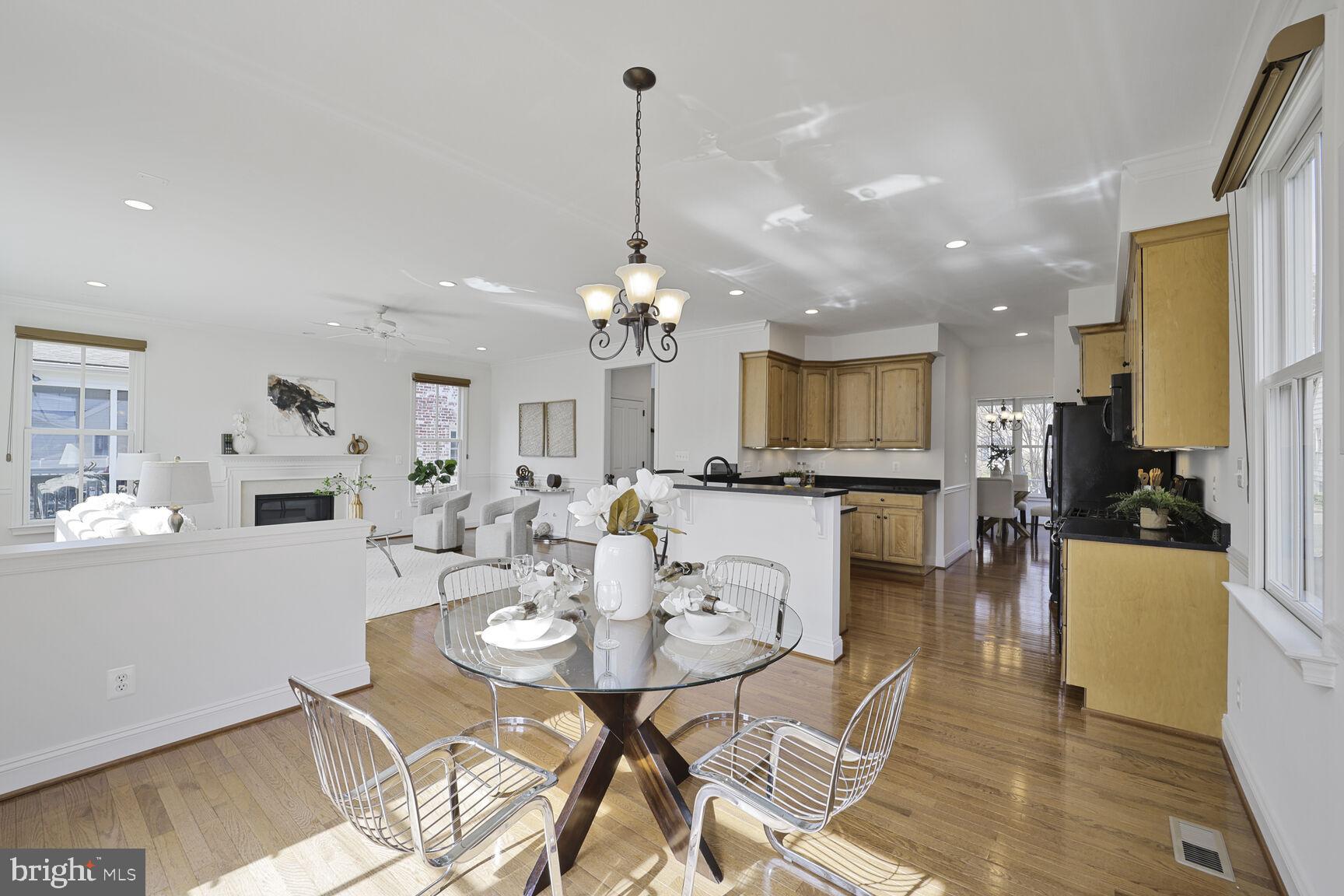 4814 25th Road North Arlington, VA 22207 - Photo 18 of 45 a view of a dining room and livingroom with furniture wooden floor a chandelier