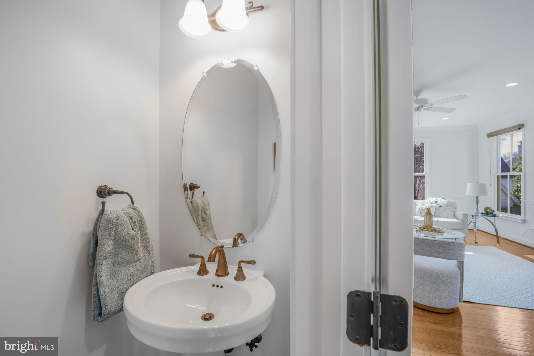 4814 25th Road North Arlington, VA 22207 - Photo 19 of 45 a bathroom with a sink and a mirror