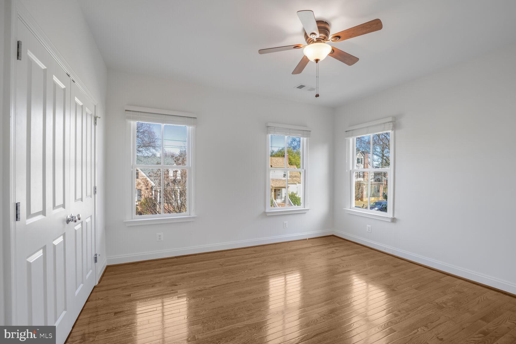 4814 25th Road North Arlington, VA 22207 - Photo 28 of 45 a view of an empty room with a window and wooden floor