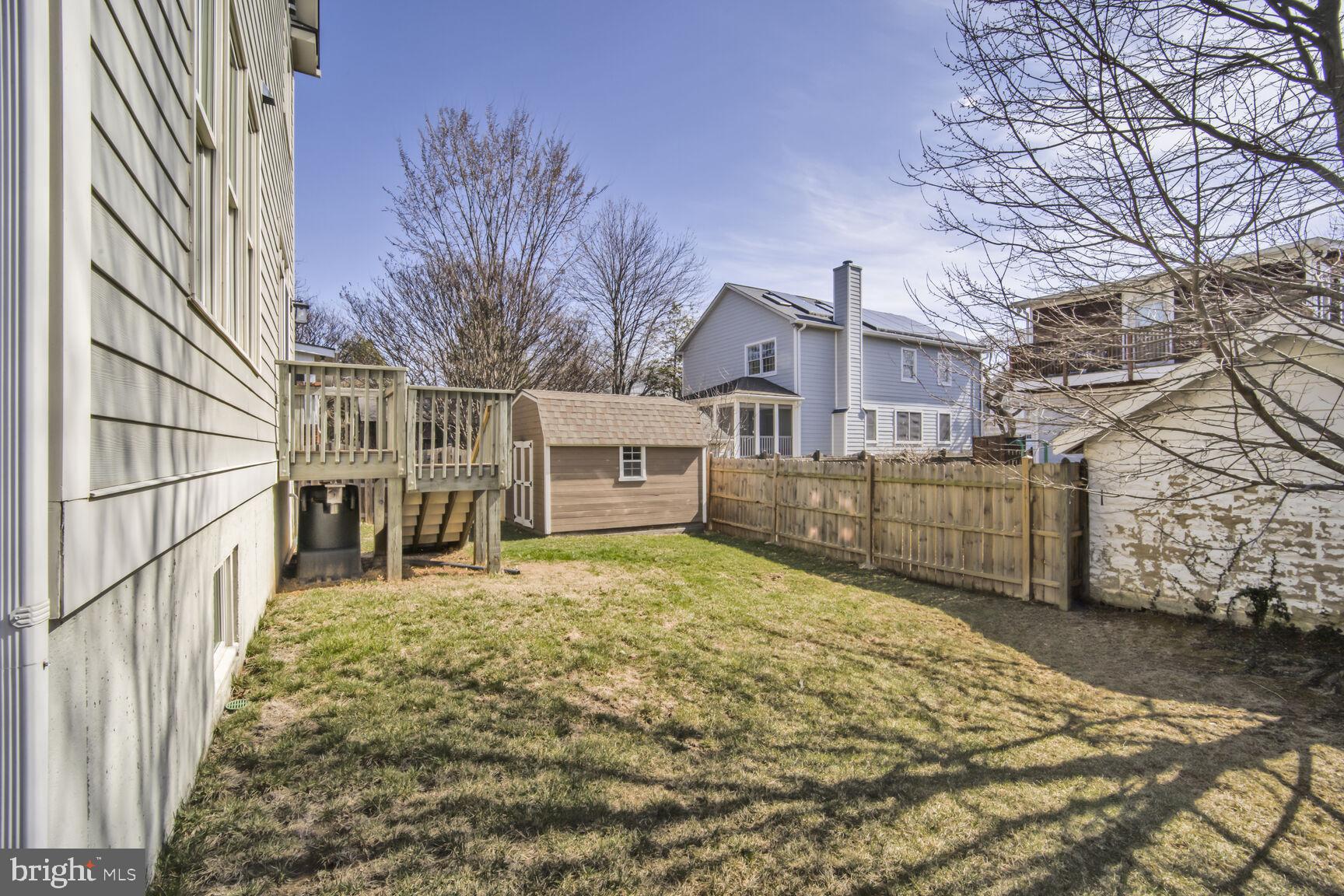 4814 25th Road North Arlington, VA 22207 - Photo 42 of 45 a view of a house with a large tree and wooden fence