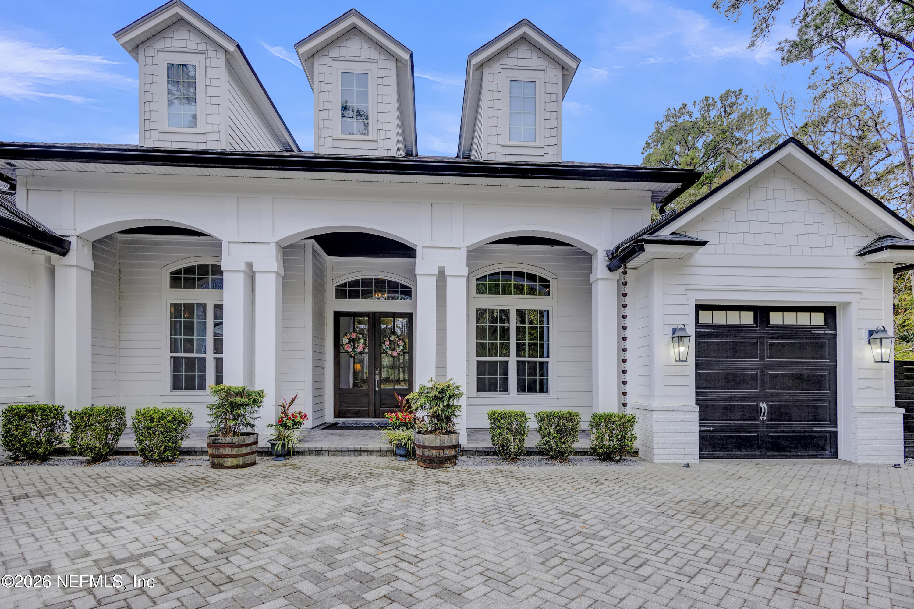 1387 Heath Road Green Cove Springs, FL 32043 - Photo 11 of 136 a front view of a house with garage
