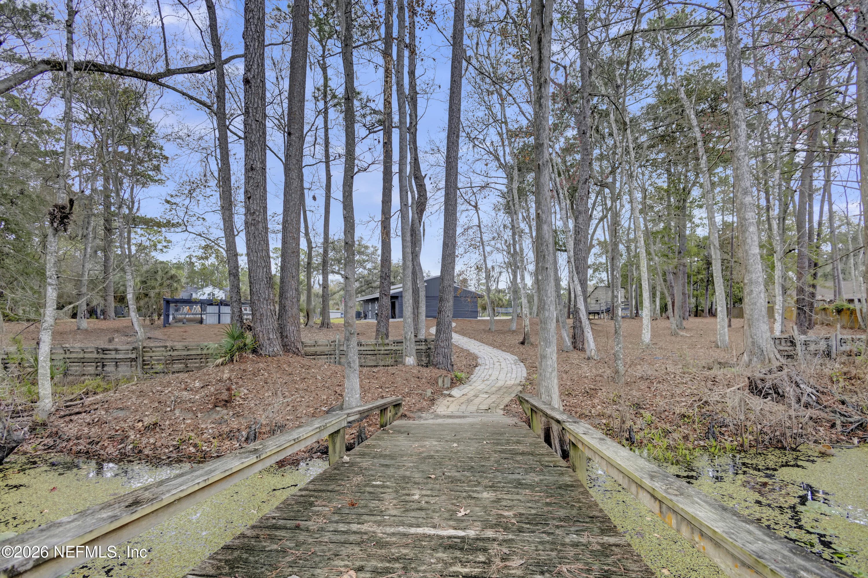 1387 Heath Road Green Cove Springs, FL 32043 - Photo 132 of 136 a view of a yard with large trees