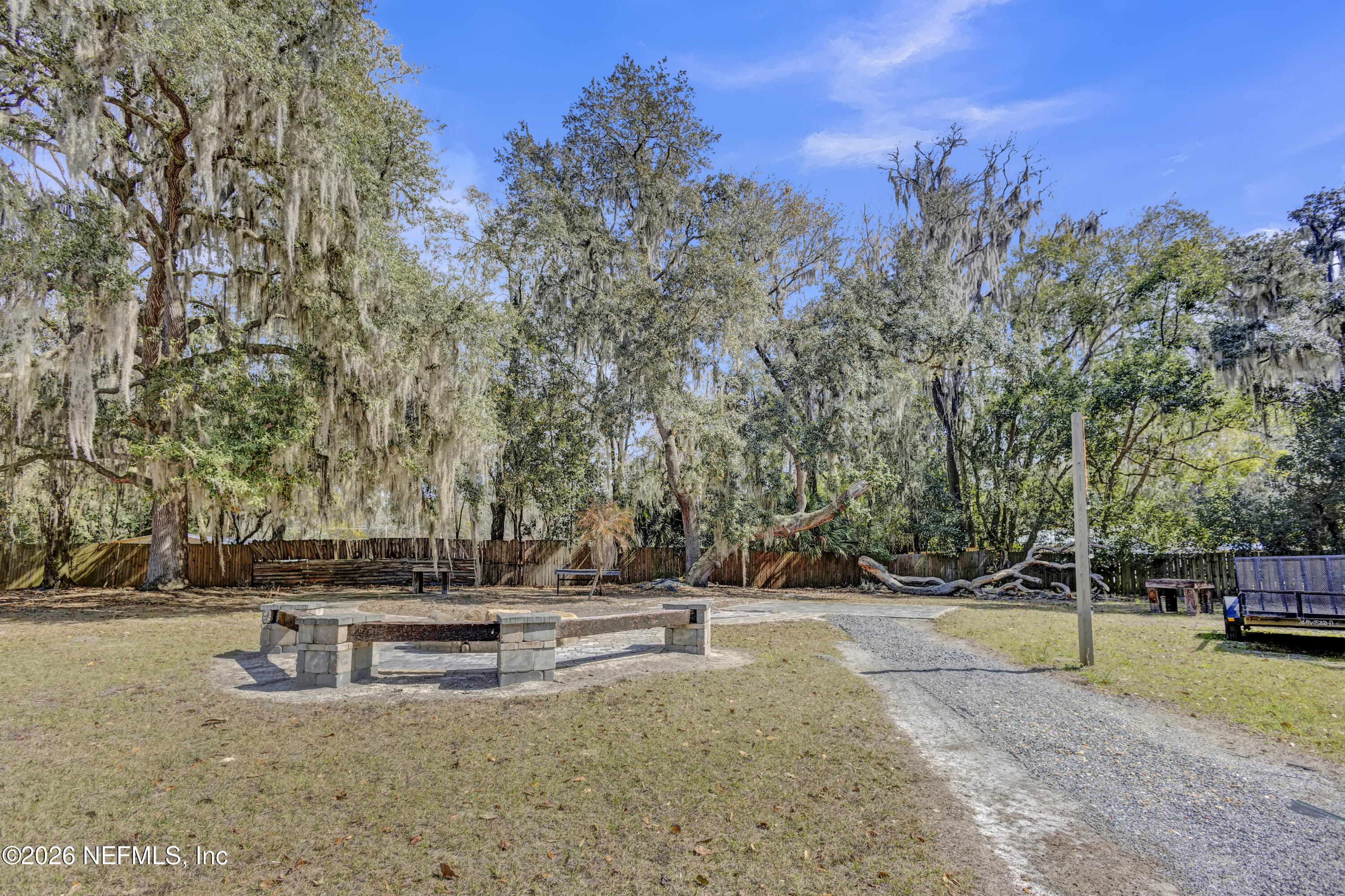 1387 Heath Road Green Cove Springs, FL 32043 - Photo 134 of 136 a view of yard with swimming pool and trees