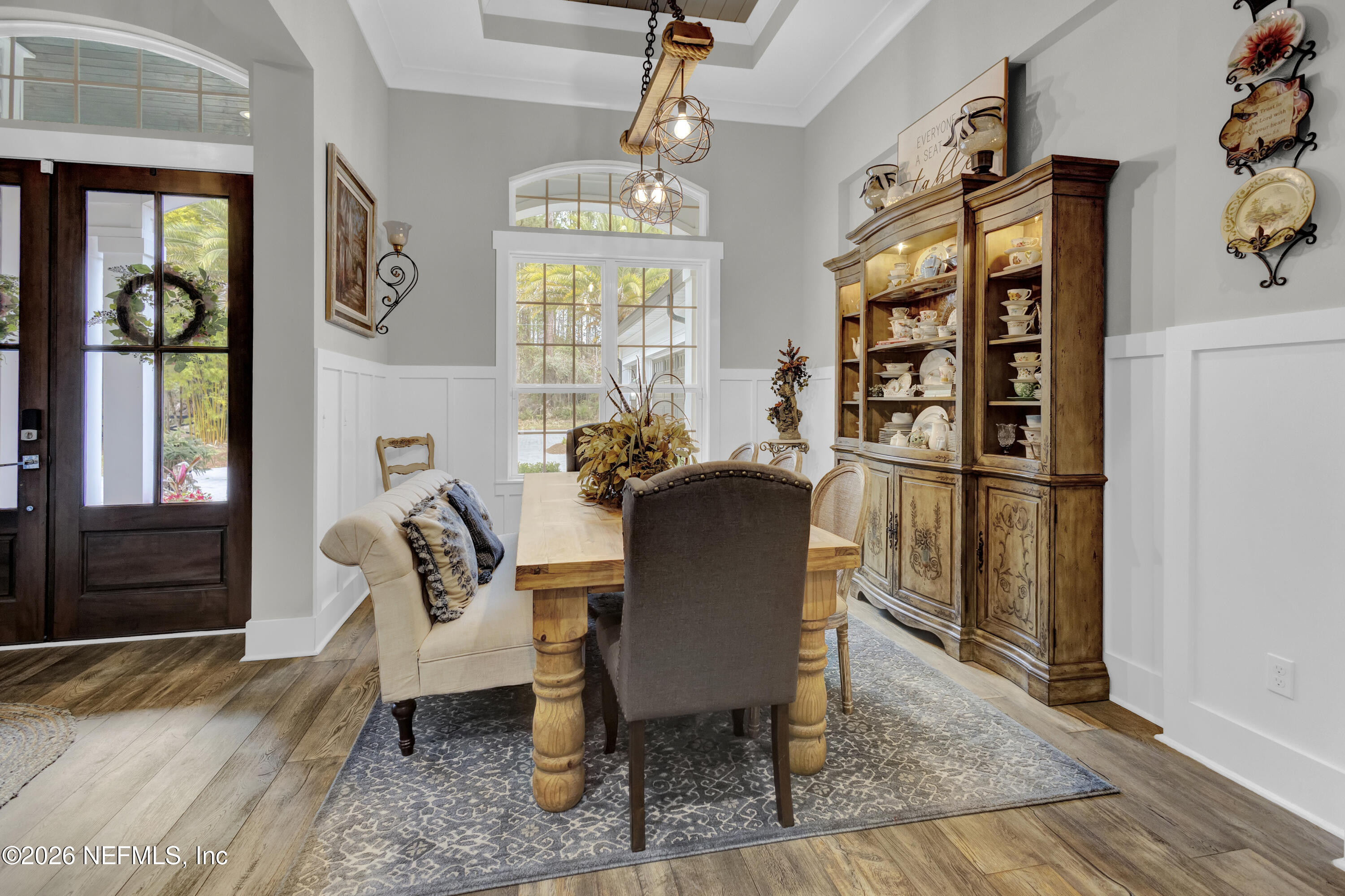 1387 Heath Road Green Cove Springs, FL 32043 - Photo 15 of 136 a view of a dining room with furniture window and wooden floor