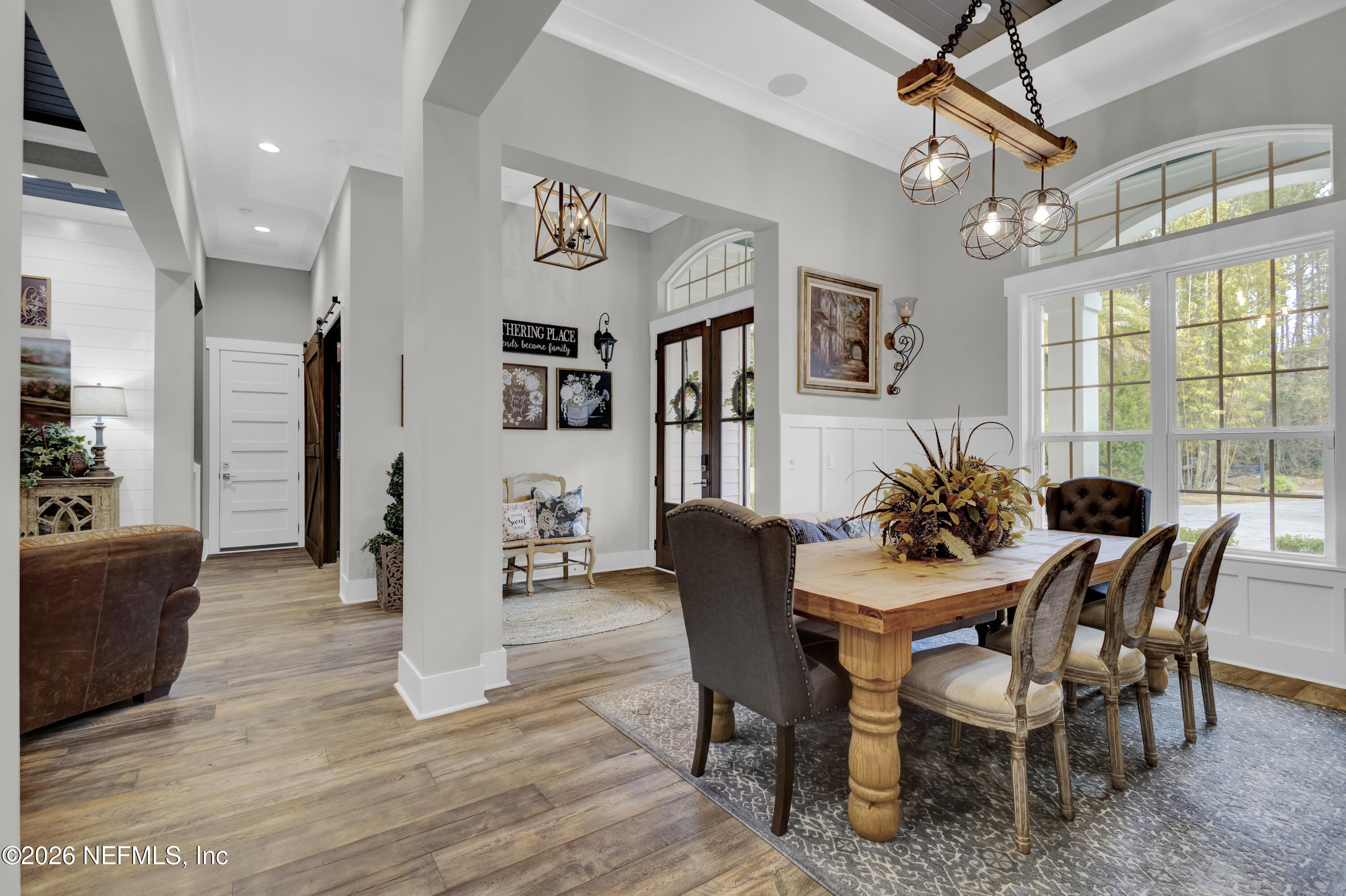 1387 Heath Road Green Cove Springs, FL 32043 - Photo 16 of 136 a view of a dining room with furniture window and wooden floor