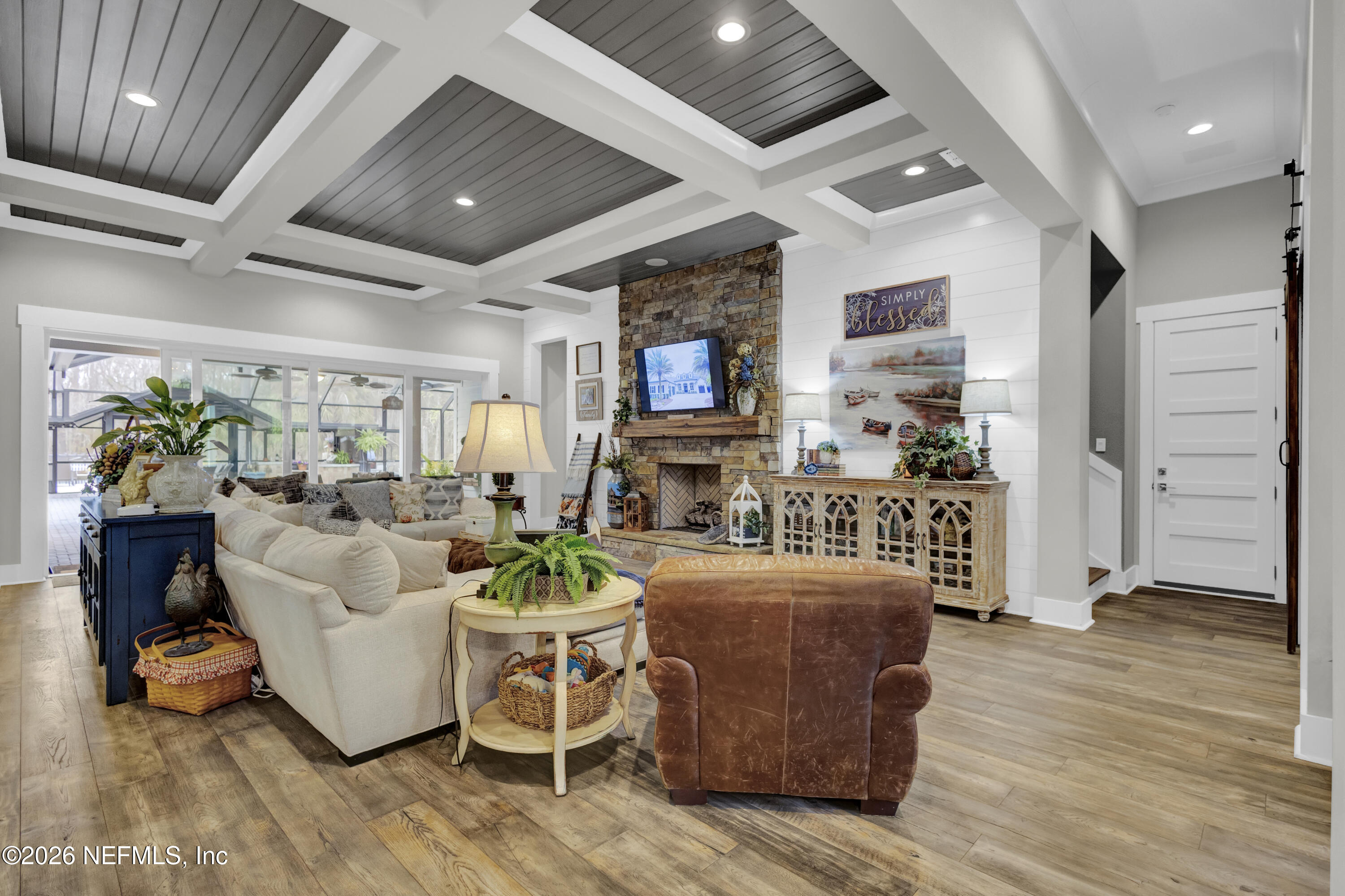 1387 Heath Road Green Cove Springs, FL 32043 - Photo 17 of 136 a living room with furniture wooden floor and a fireplace