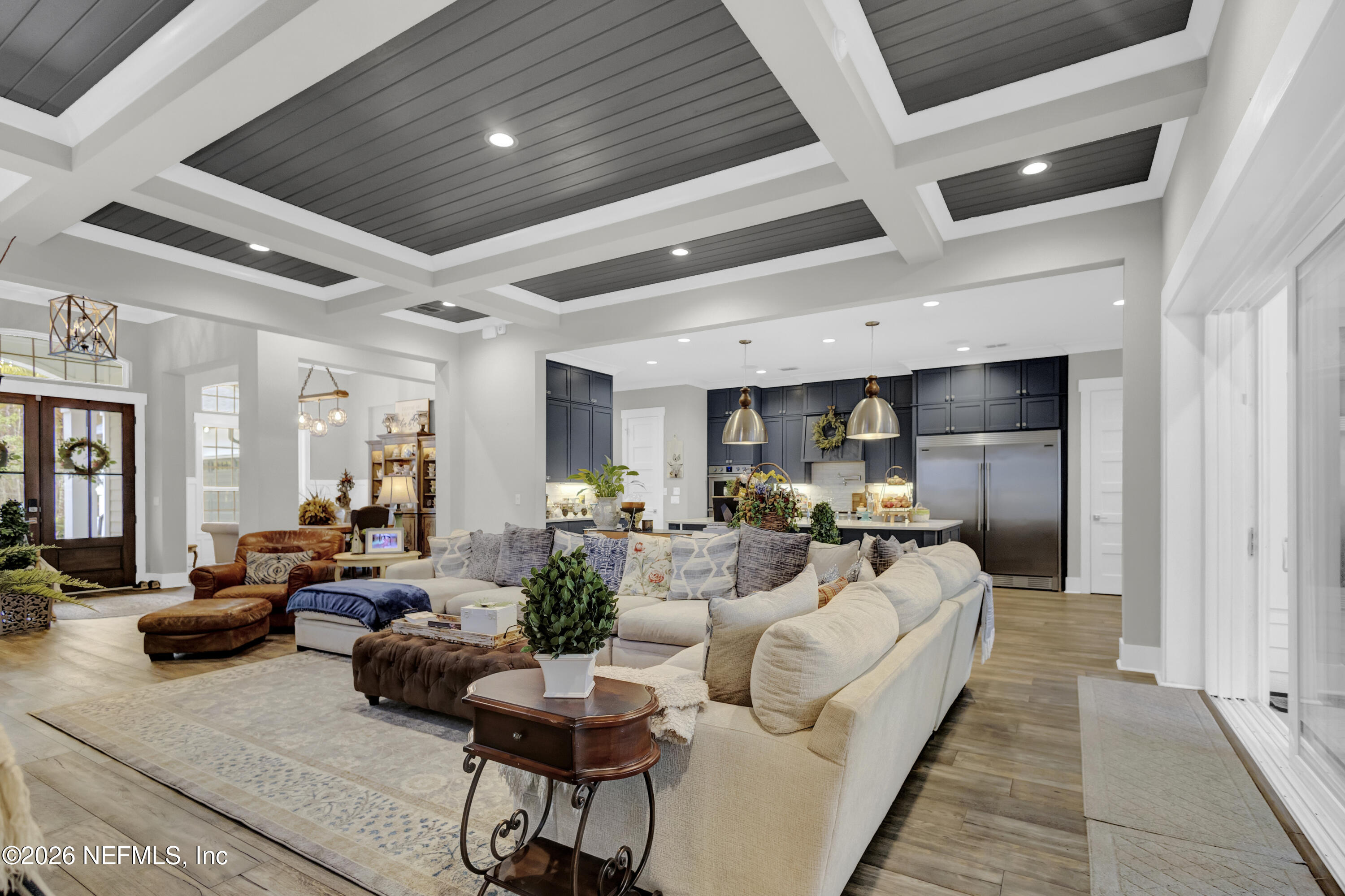 1387 Heath Road Green Cove Springs, FL 32043 - Photo 19 of 136 a living room with furniture and a large window