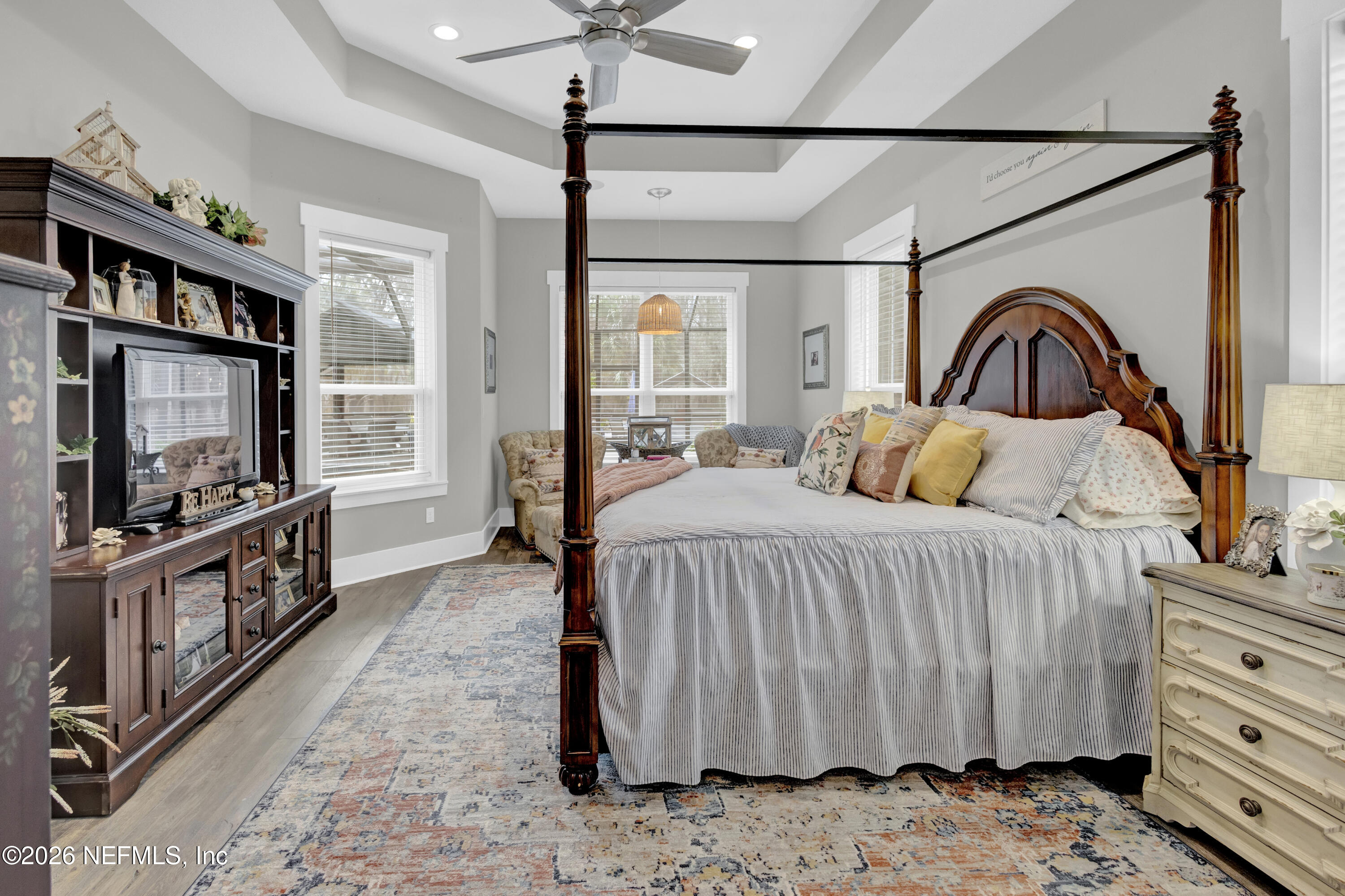1387 Heath Road Green Cove Springs, FL 32043 - Photo 37 of 136 a bedroom with a bed and a flat tv screen on dresser