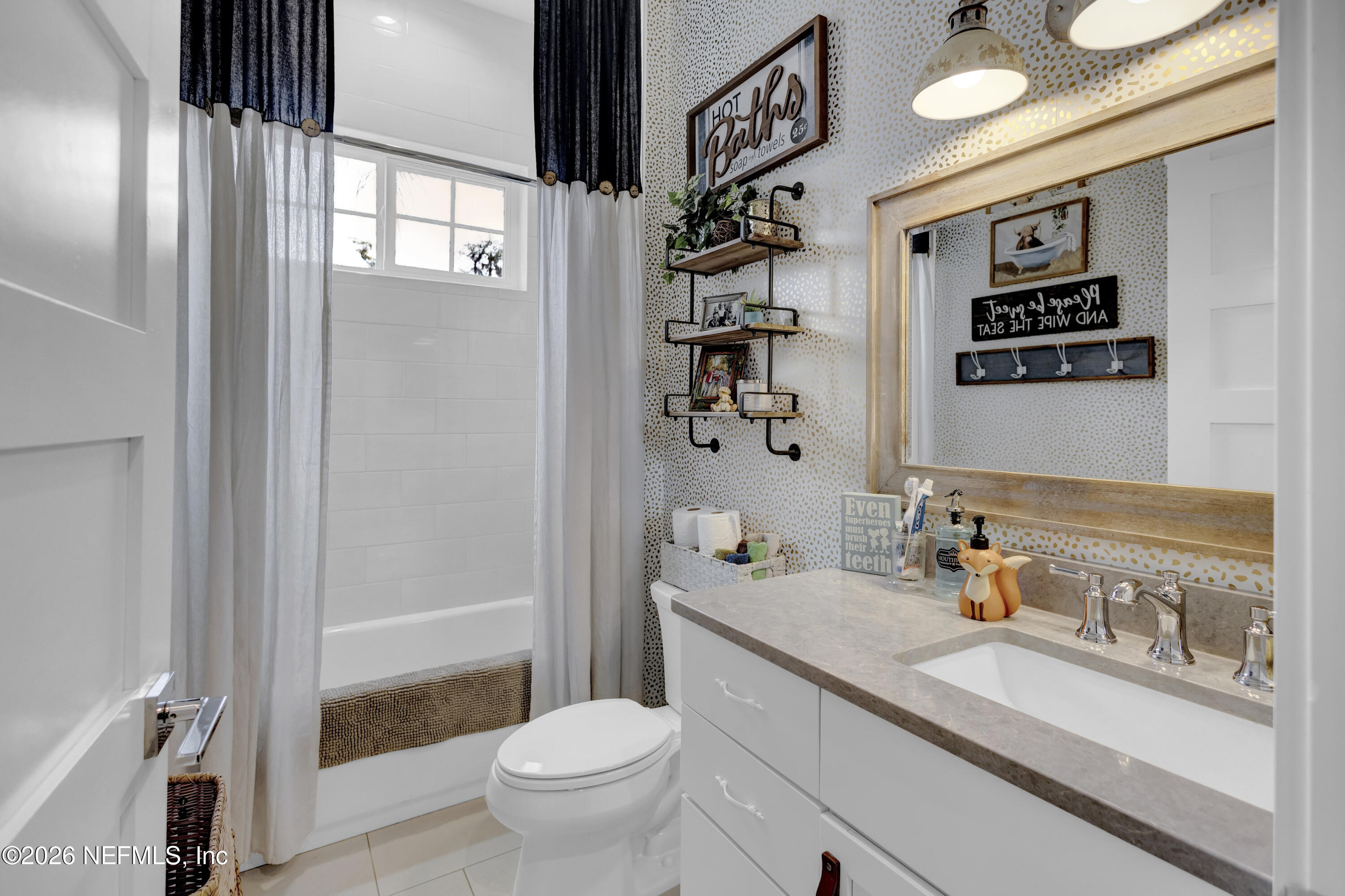 1387 Heath Road Green Cove Springs, FL 32043 - Photo 42 of 136 a bathroom with a sink a toilet and shower