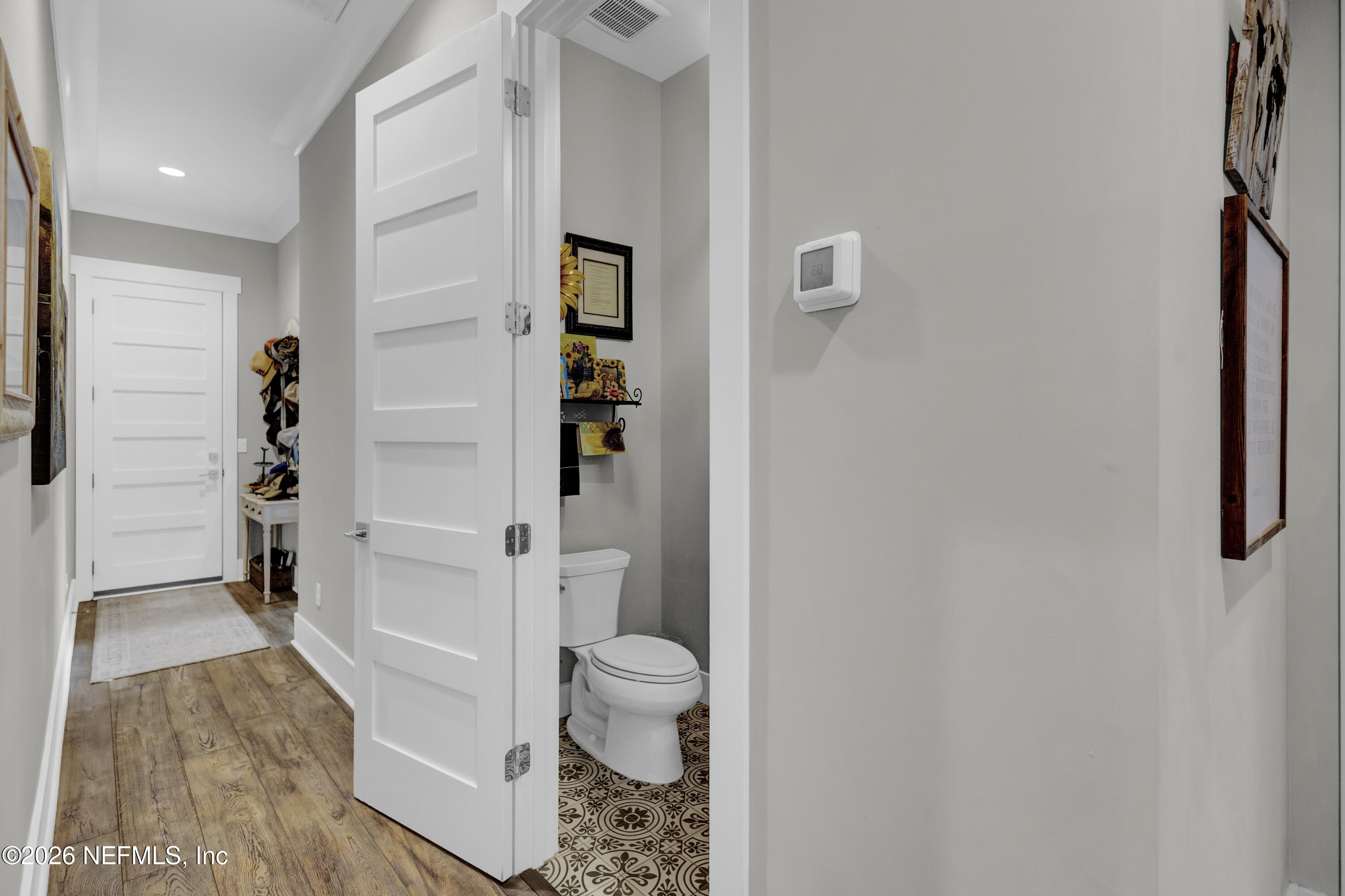 1387 Heath Road Green Cove Springs, FL 32043 - Photo 45 of 136 a bathroom with a toilet and a shower