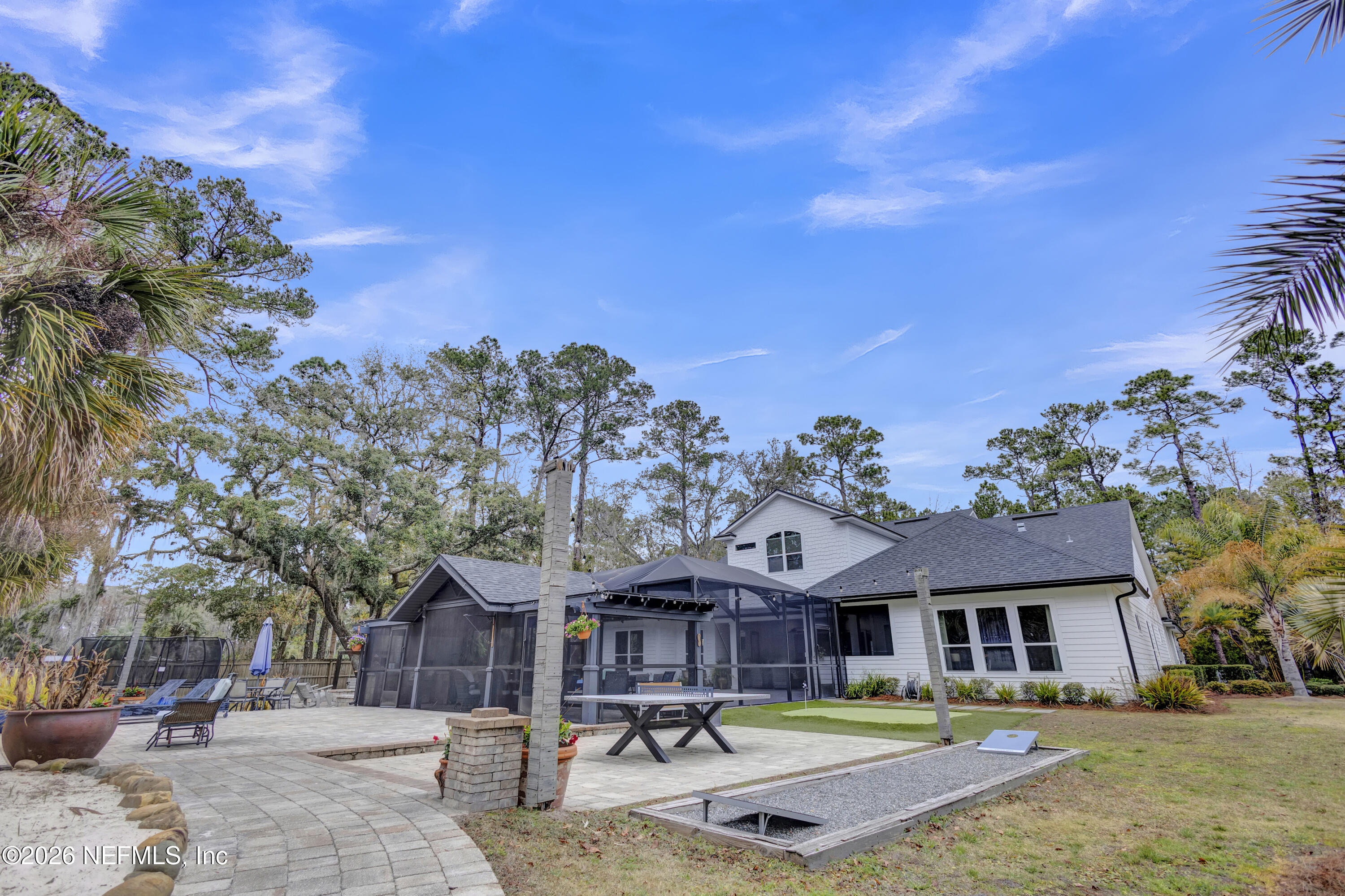 1387 Heath Road Green Cove Springs, FL 32043 - Photo 66 of 136 a swimming pool view with a seating space and a garden view