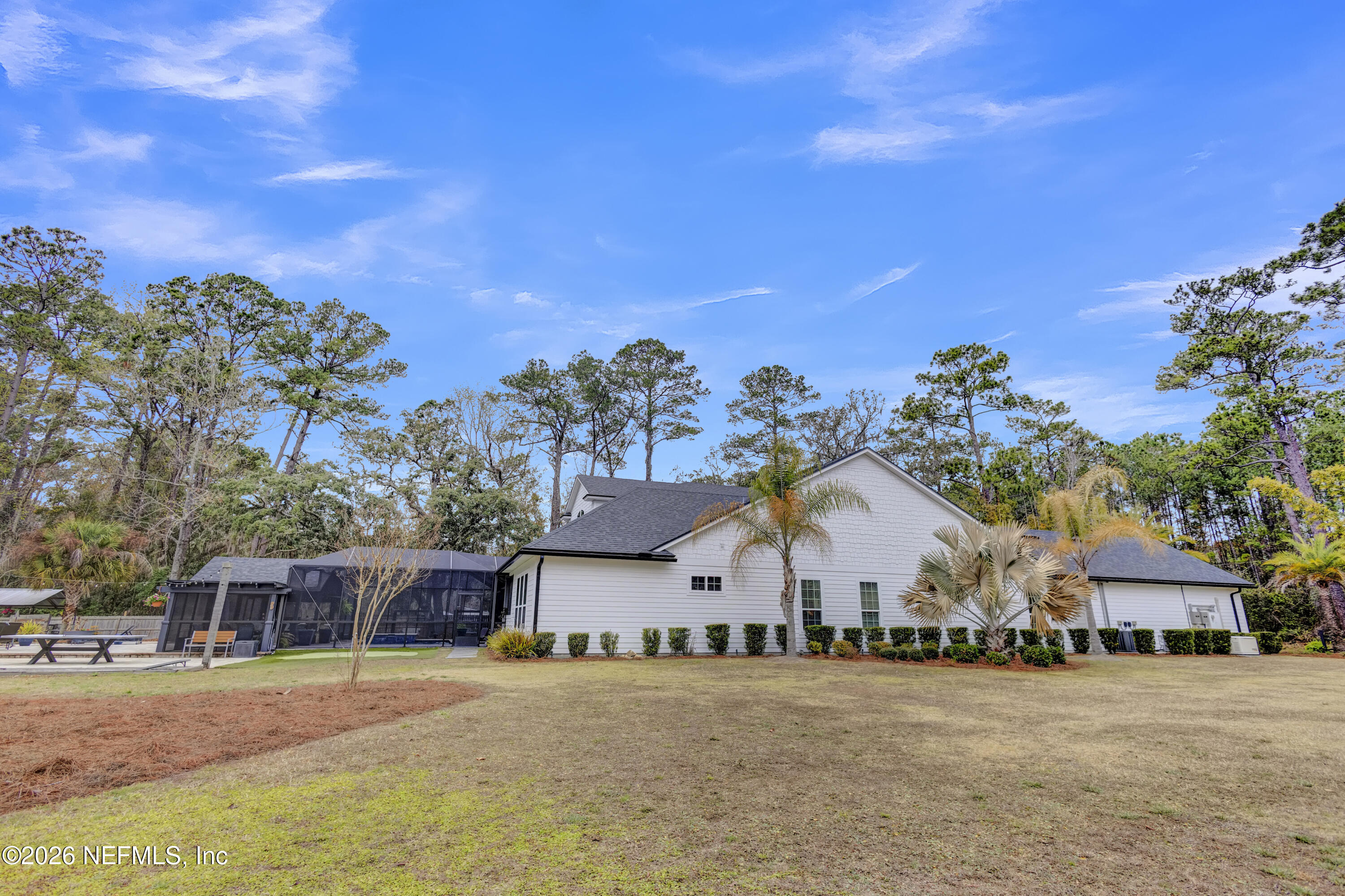 1387 Heath Road Green Cove Springs, FL 32043 - Photo 69 of 136 a front view of a house with a yard and trees