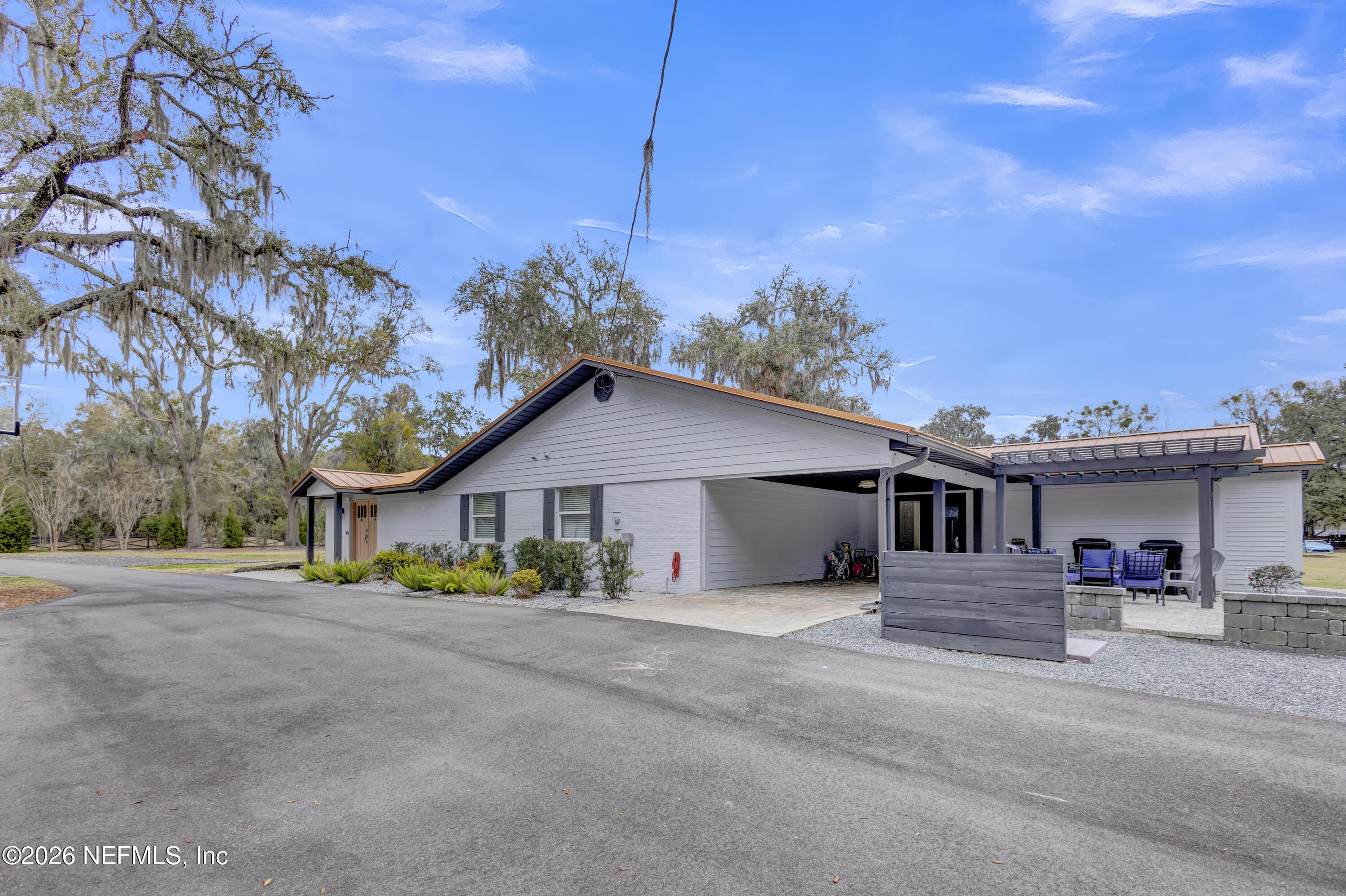 1387 Heath Road Green Cove Springs, FL 32043 - Photo 81 of 136 a front view of a house with a garden