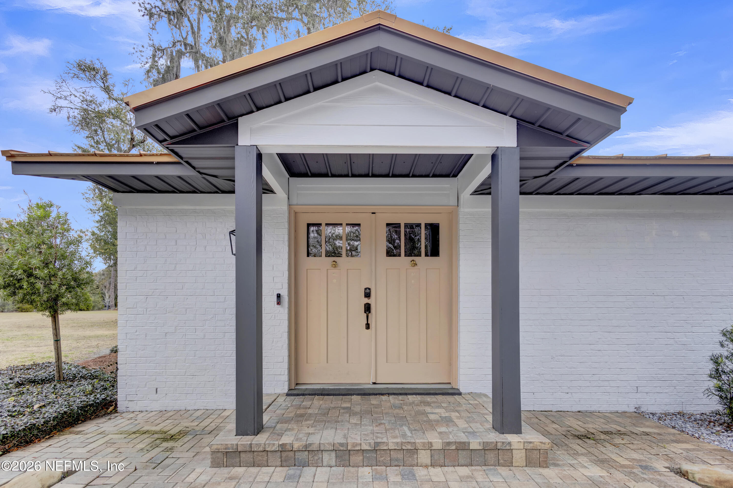 1387 Heath Road Green Cove Springs, FL 32043 - Photo 83 of 136 a front view of a house with a wooden fence