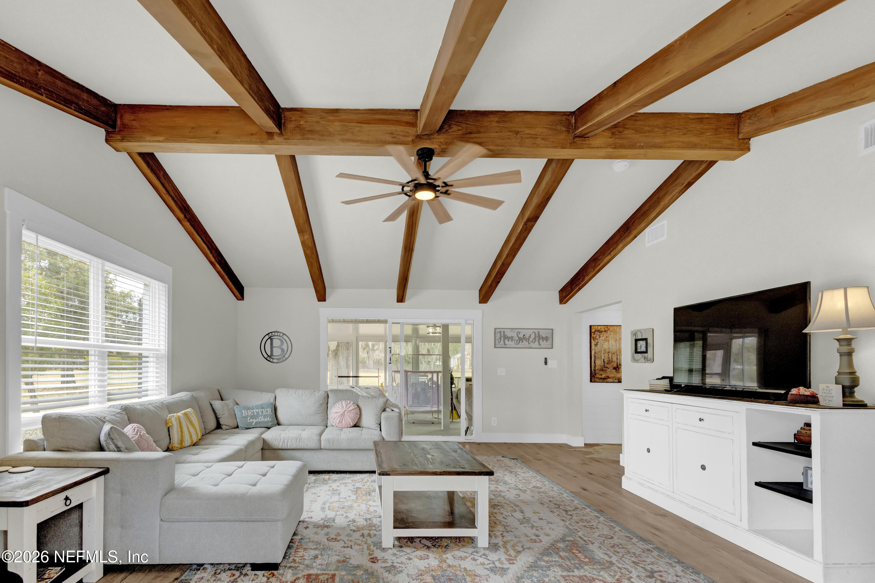 1387 Heath Road Green Cove Springs, FL 32043 - Photo 84 of 136 a living room with furniture and a flat screen tv