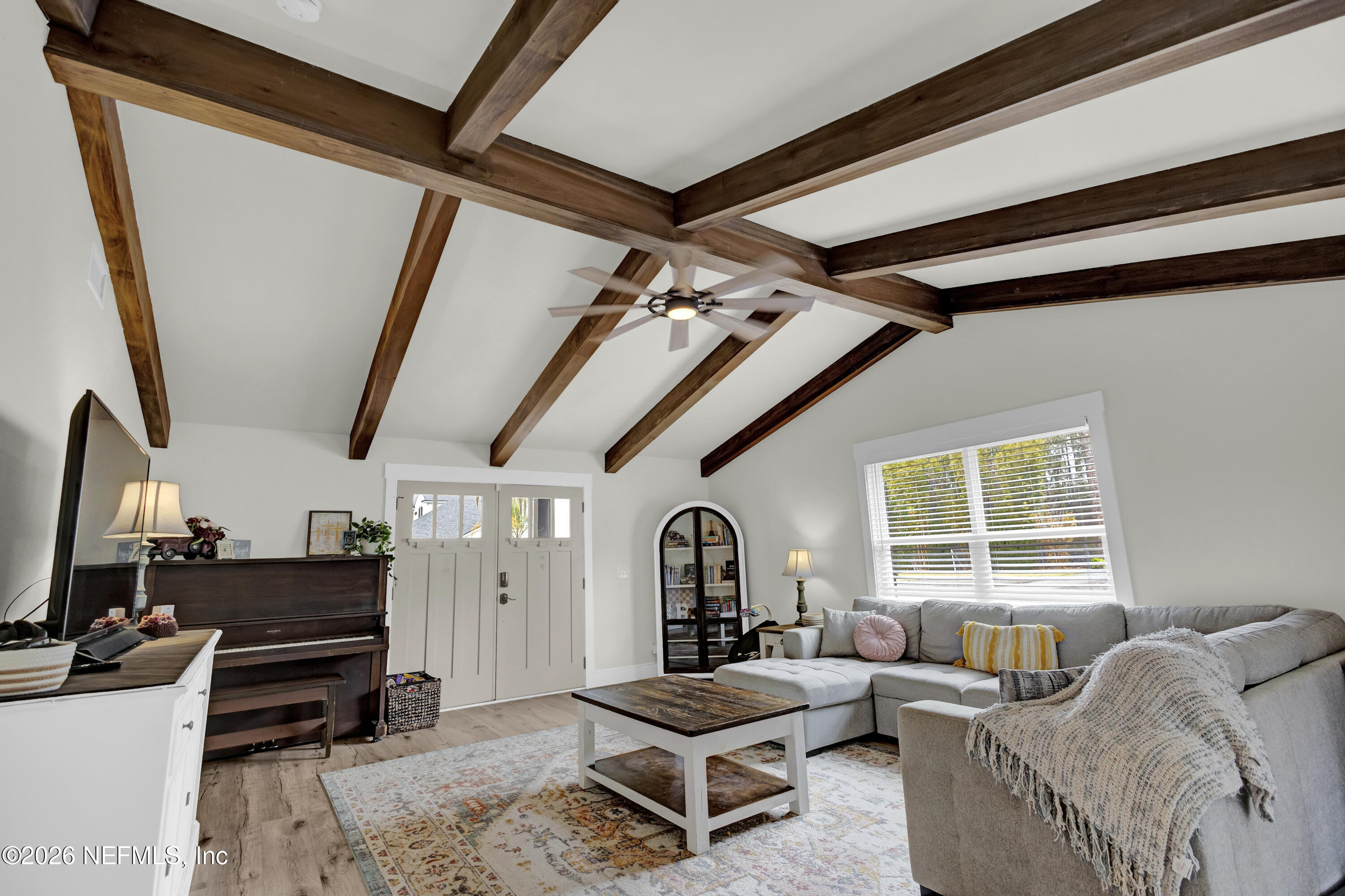 1387 Heath Road Green Cove Springs, FL 32043 - Photo 86 of 136 a living room with furniture and a flat screen tv