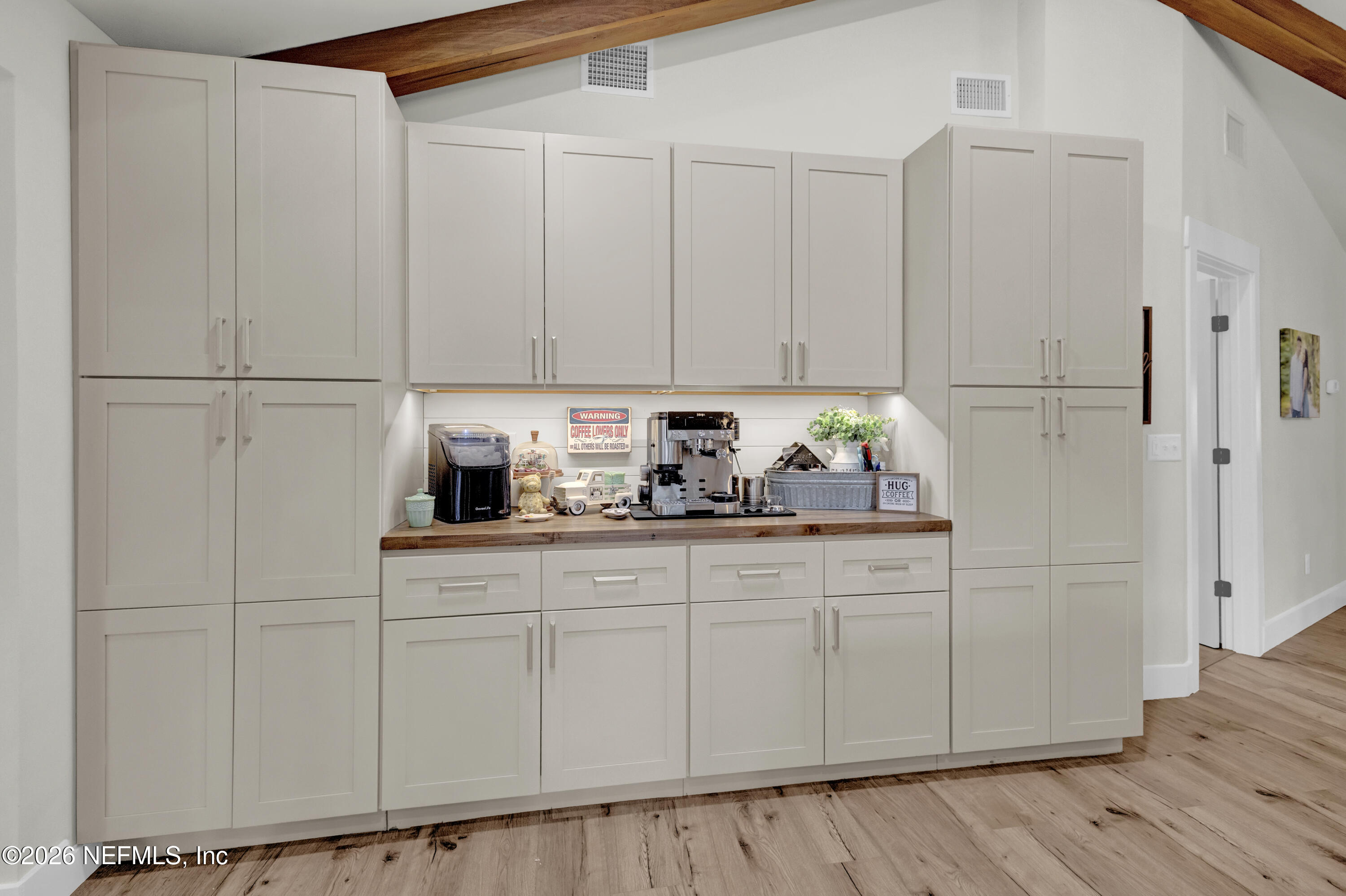 1387 Heath Road Green Cove Springs, FL 32043 - Photo 90 of 136 a kitchen with granite countertop white cabinets and stainless steel appliances