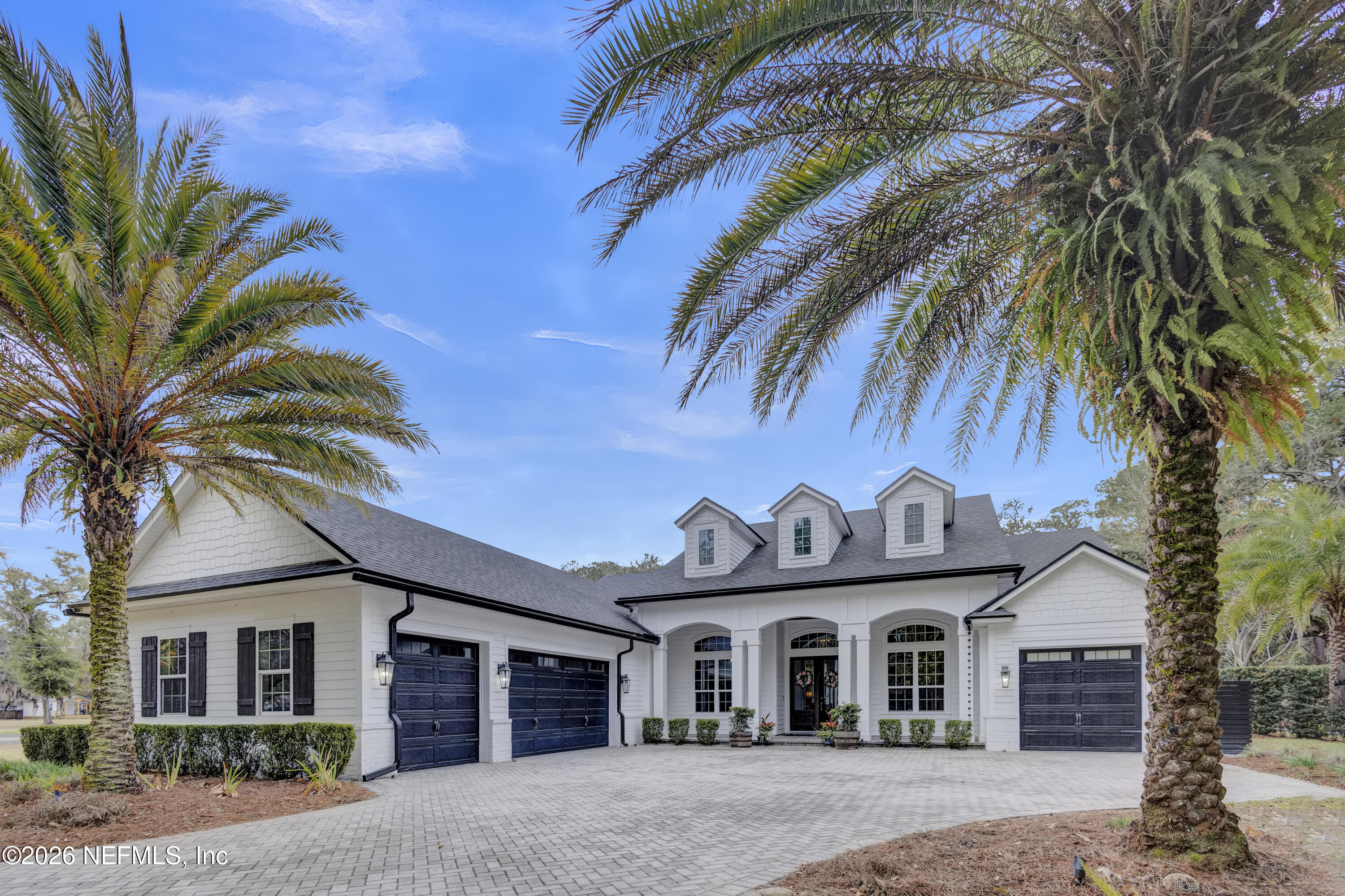 1387 Heath Road Green Cove Springs, FL 32043 - Photo 10 of 136 a view of a house with a palm tree