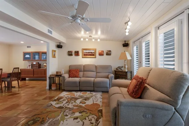 a bathroom with a double vanity sink a mirror and a bathtub