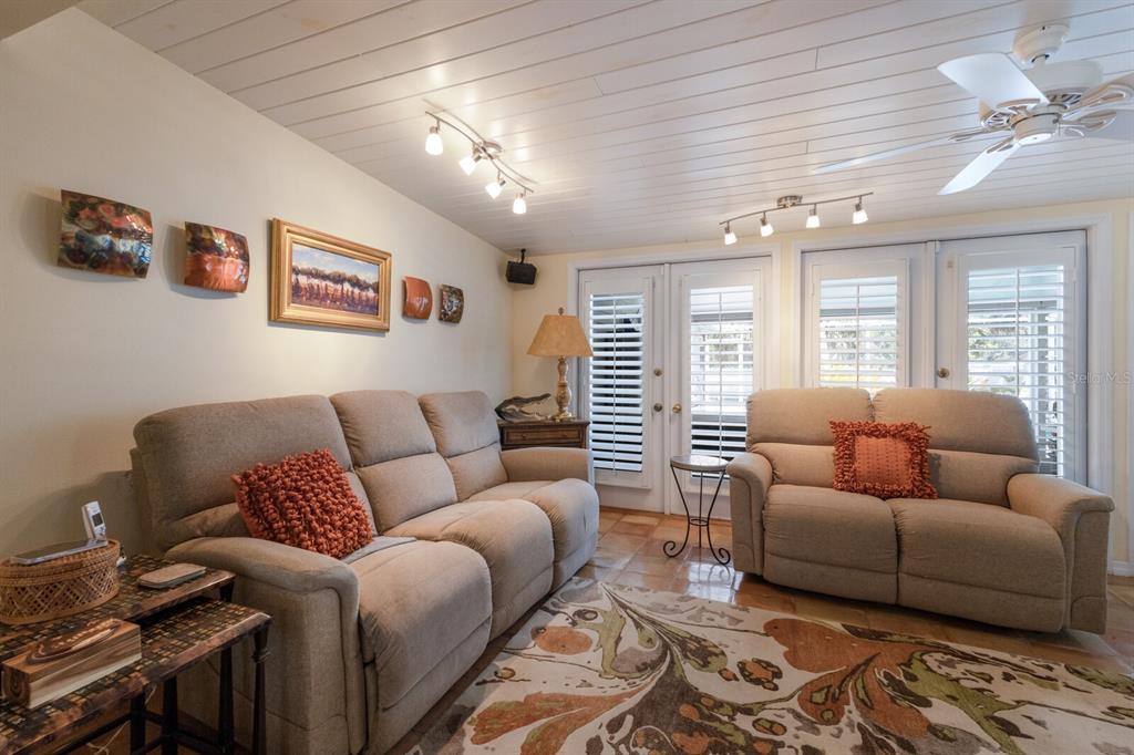 2723 59th Street Sarasota, FL 34243 - Photo 22 of 75 a living room with furniture and a large window