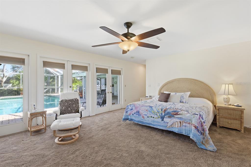 2723 59th Street Sarasota, FL 34243 - Photo 32 of 75 a bedroom with a bed and a large window