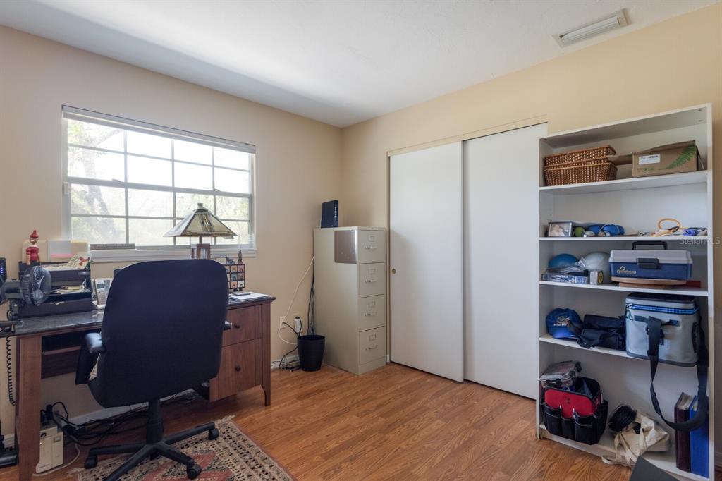 2723 59th Street Sarasota, FL 34243 - Photo 36 of 75 a livingroom with workspace chair and a window