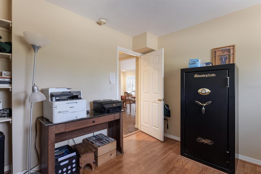 2723 59th Street Sarasota, FL 34243 - Photo 37 of 75 a view of a workspace with furniture and wooden floor