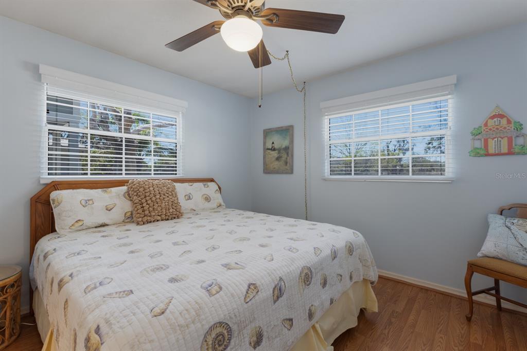 2723 59th Street Sarasota, FL 34243 - Photo 38 of 75 a bedroom with a large bed and a window