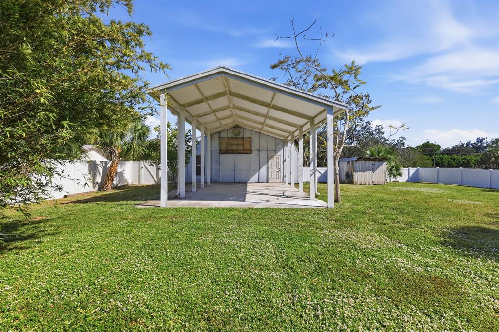 2723 59th Street Sarasota, FL 34243 - Photo 57 of 75 a view of a house with a yard