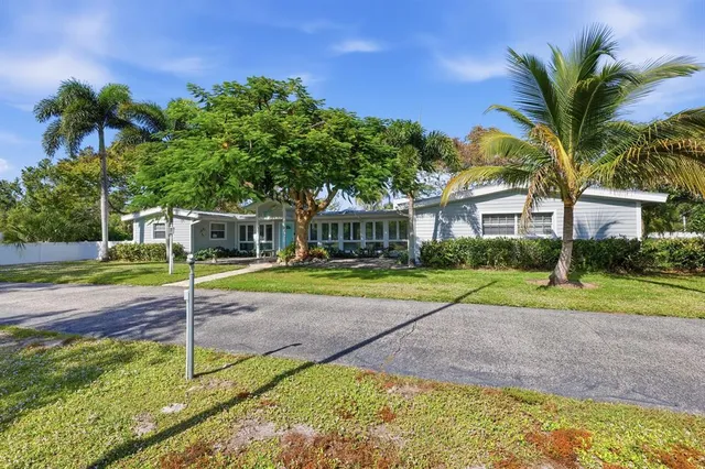 an aerial view of a residential apartment building with a yard