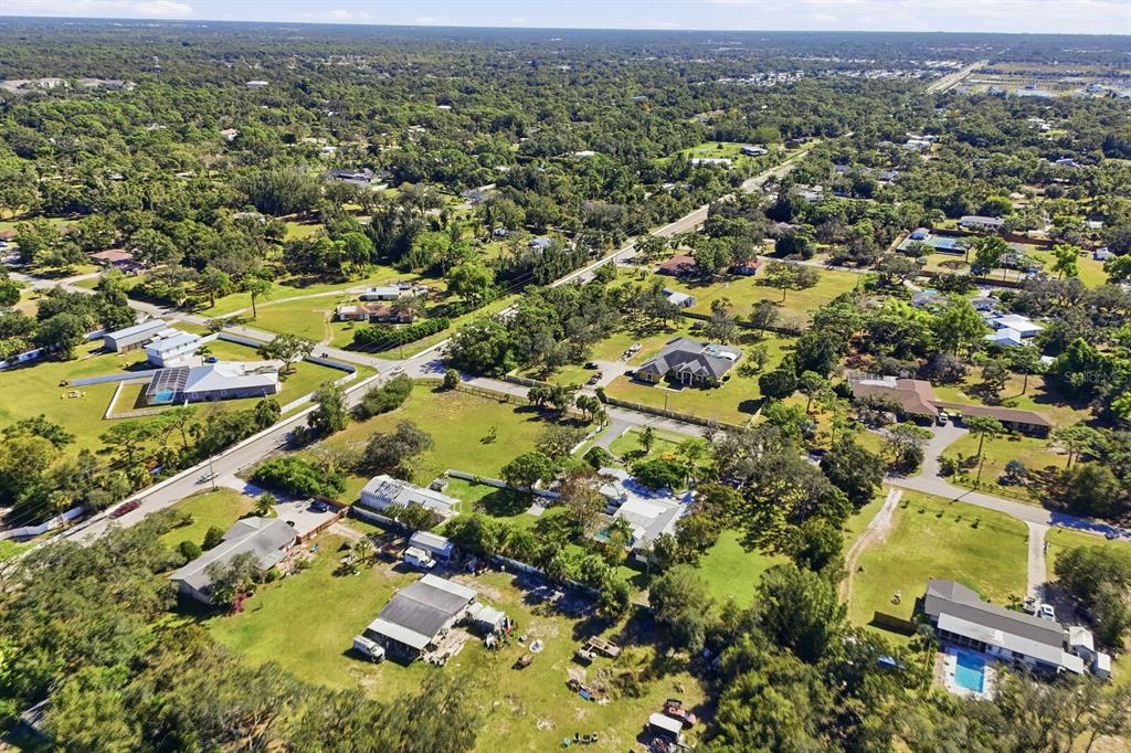 2723 59th Street Sarasota, FL 34243 - Photo 71 of 75 an aerial view of residential houses with outdoor space and trees