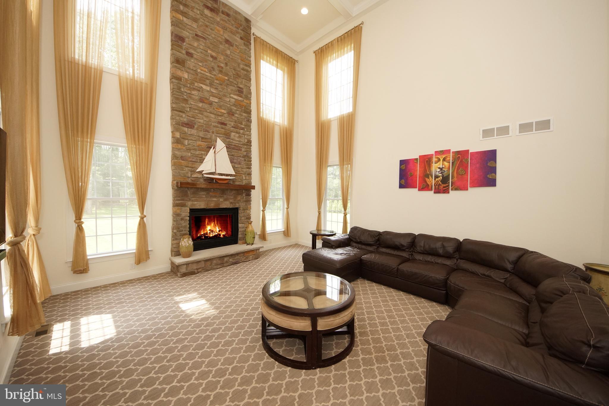 5 Harness Court Cream Ridge, NJ 08514 - Photo 39 of 71 Gathering room with floor to ceiling stone gas F/P
