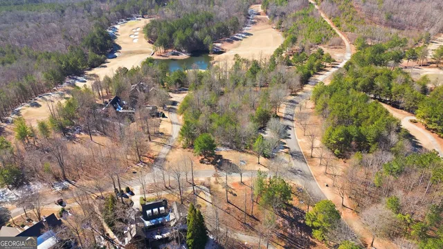 a view of a lake with a yard and mountain view