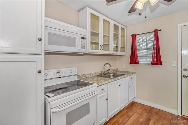 a kitchen with a sink and cabinets