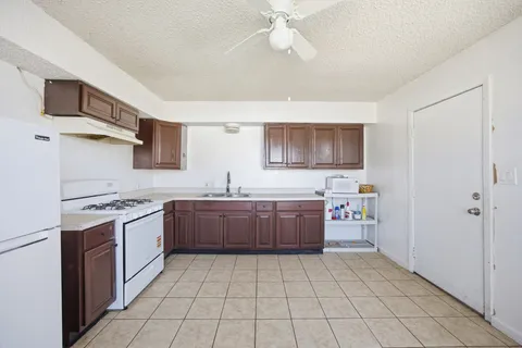 a kitchen with stainless steel appliances a sink and a stove