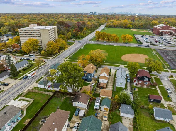 an aerial view of residential houses with outdoor space