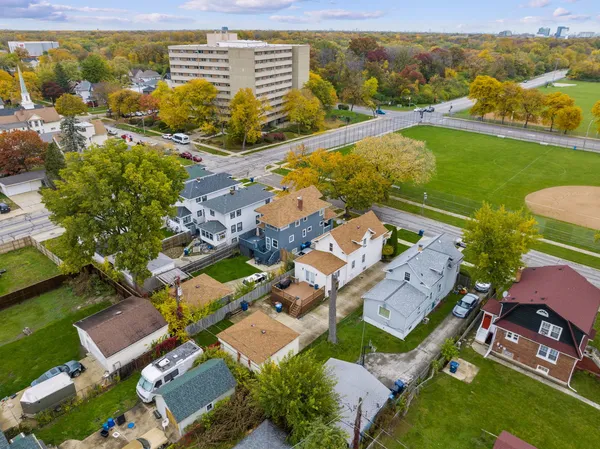 an aerial view of residential houses with outdoor space
