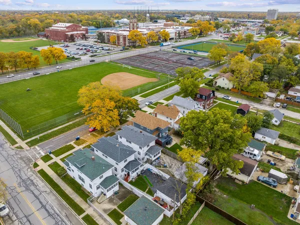 an aerial view of residential houses with outdoor space