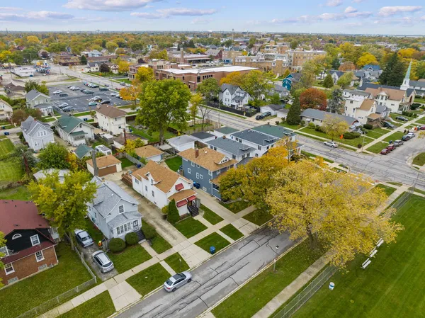 an aerial view of residential houses with outdoor space