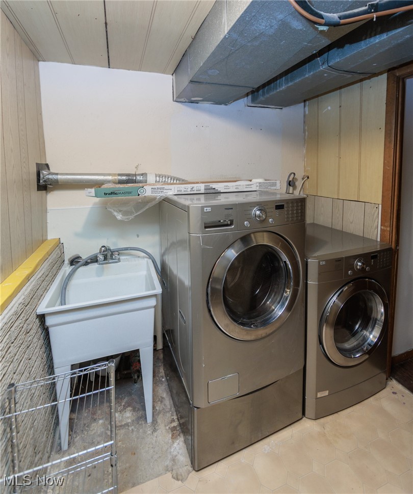 28013 Knickerbocker Road Bay Village, OH 44140 - Photo 34 of 38 Laundry room featuring separate washer and dryer