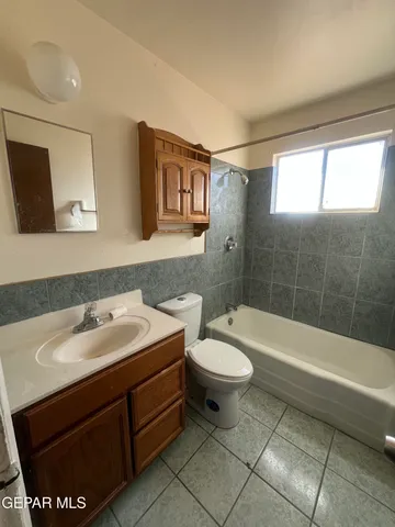 a bathroom with a sink a toilet and a bathtub