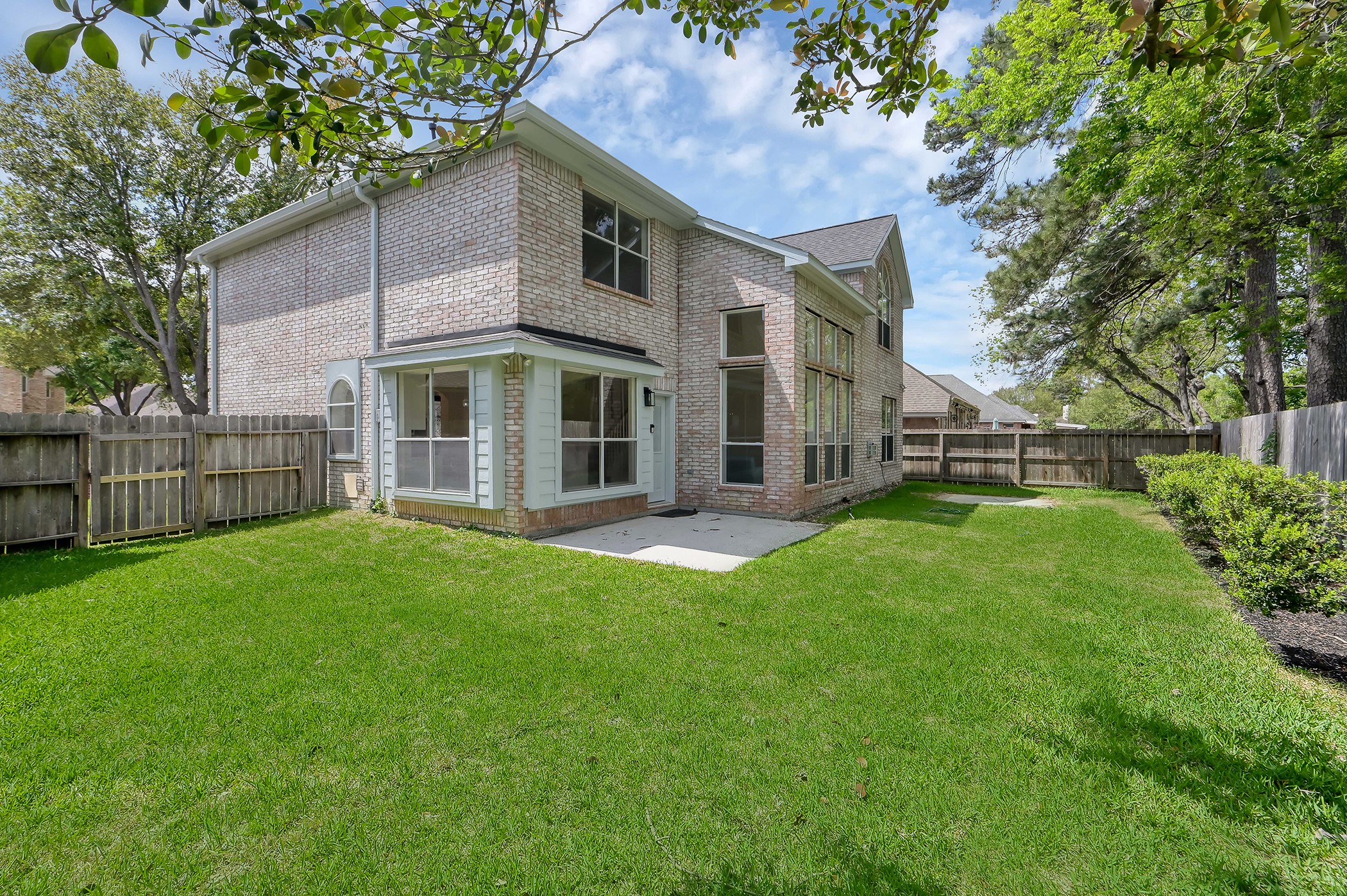 18310 Rittenhouse Park Court Spring, TX 77379 - Photo 27 of 35 Large backyard with brand new grass and low maintenance landscaping.