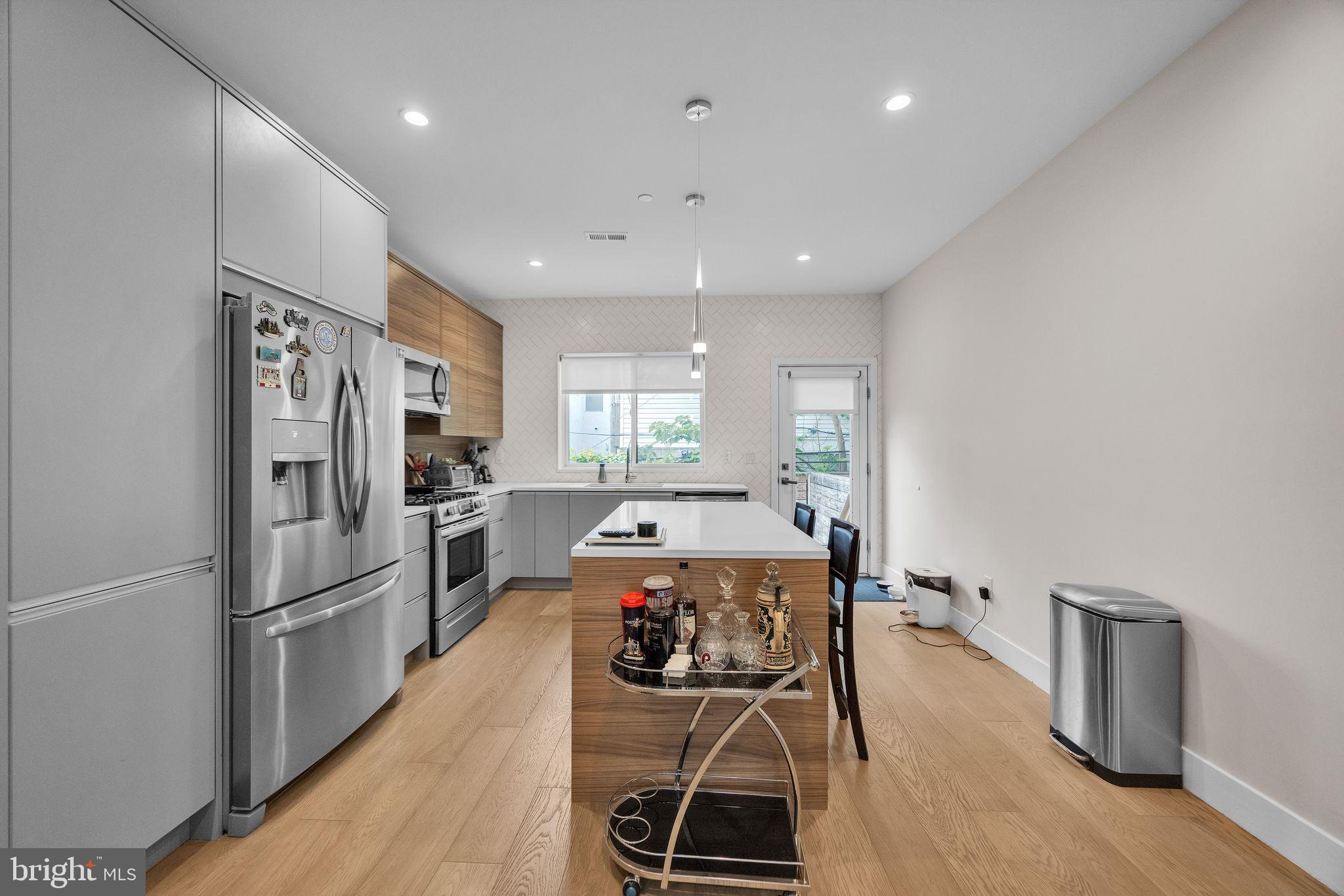 1752 North Bailey Street Philadelphia, PA 19121 - Photo 12 of 30 a large kitchen with a table and chairs