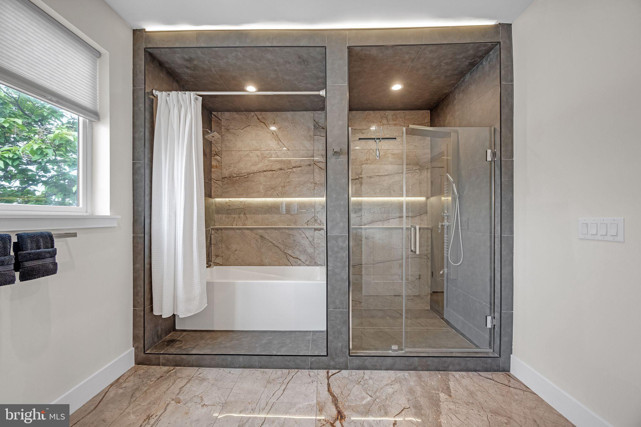 1752 North Bailey Street Philadelphia, PA 19121 - Photo 19 of 30 a bathroom with a glass shower door