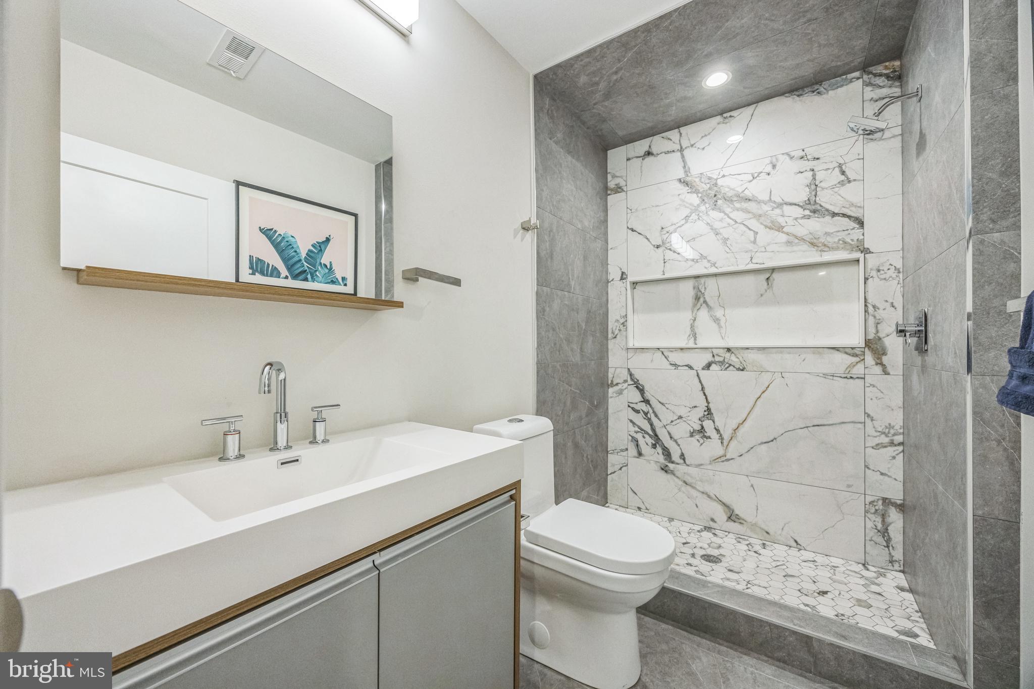 1752 North Bailey Street Philadelphia, PA 19121 - Photo 22 of 30 a bathroom with a sink a toilet and shower