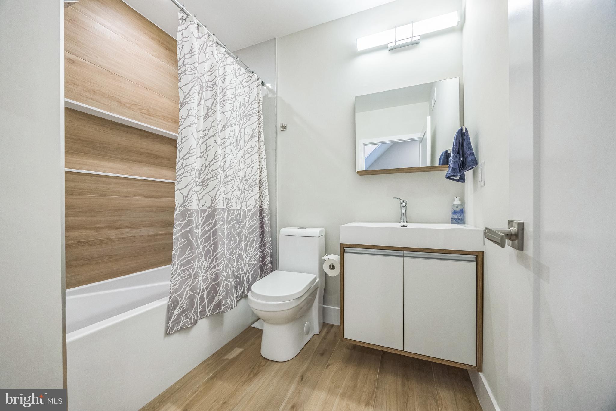 1752 North Bailey Street Philadelphia, PA 19121 - Photo 27 of 30 a bathroom with a sink toilet and shower