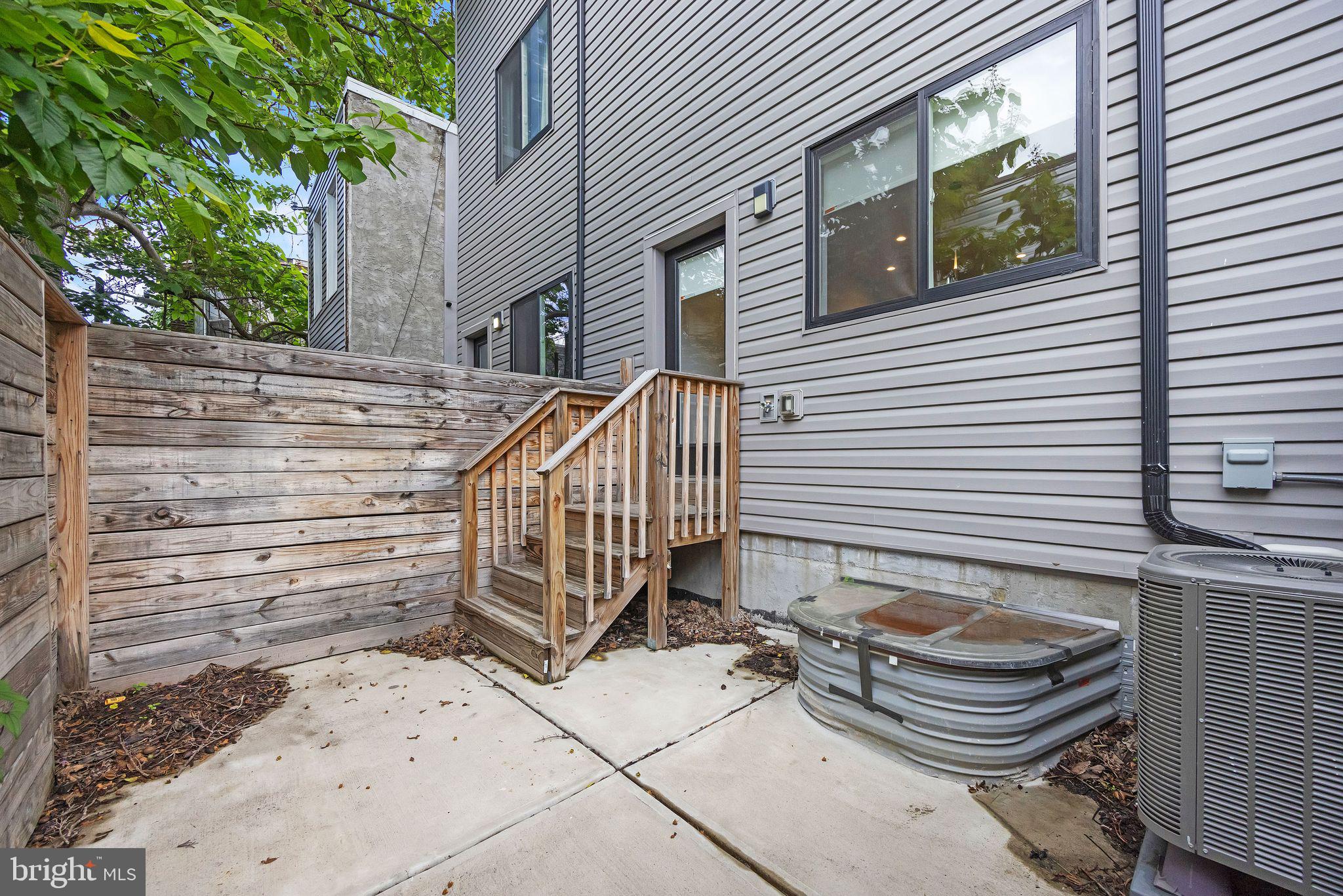 1752 North Bailey Street Philadelphia, PA 19121 - Photo 29 of 30 a view of a chair and table in backyard