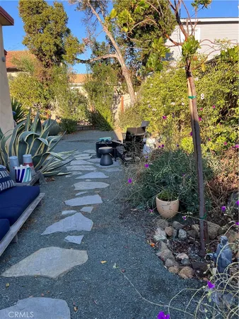 a view of a backyard with sitting area